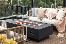 Load image into Gallery viewer, Elementi Granville in dark gray with flame on a patio/deck