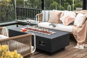 Elementi Granville in dark gray with flame on a patio/deck