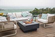 Load image into Gallery viewer, Elementi fire pit table outside on a deck overlooking the ocean