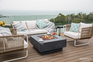 Elementi fire pit table outside on a deck overlooking the ocean