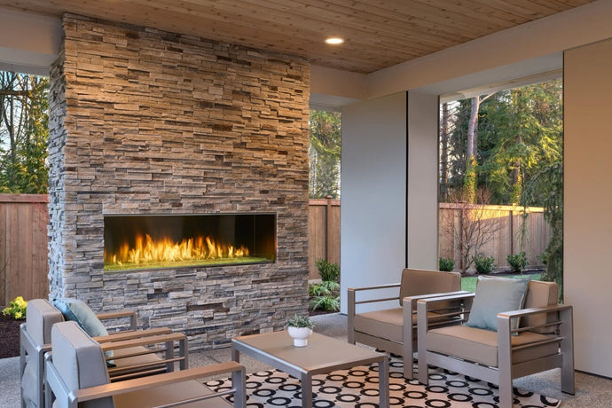 Majestic Lanai 60 fireplace on a covered patio with flames and fireglass