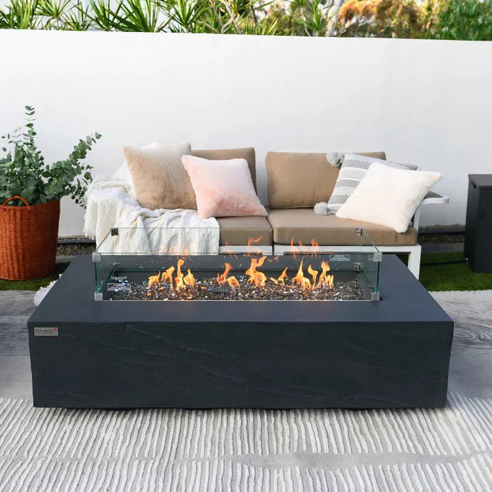 Elementi Plus Cape Town Fire pit with flames  and a wind guard onon a patio