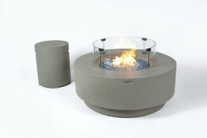 Elementi Plus Colosseo round fire pit with blue fire glass. With tank cover
