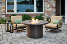 Load image into Gallery viewer, The outdoor greatroom company brown Beacon fire table shown on a patio with a flame