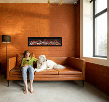 Load image into Gallery viewer, Amantii SYM XT electric fireplace with birch logs on a wall in a living room