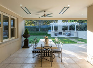Bromic platinum patio heaters shown recessed in a covered patio setting