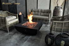 Load image into Gallery viewer, Modeno by Elementi Aurora fire pit table shown with a flame on  a patio