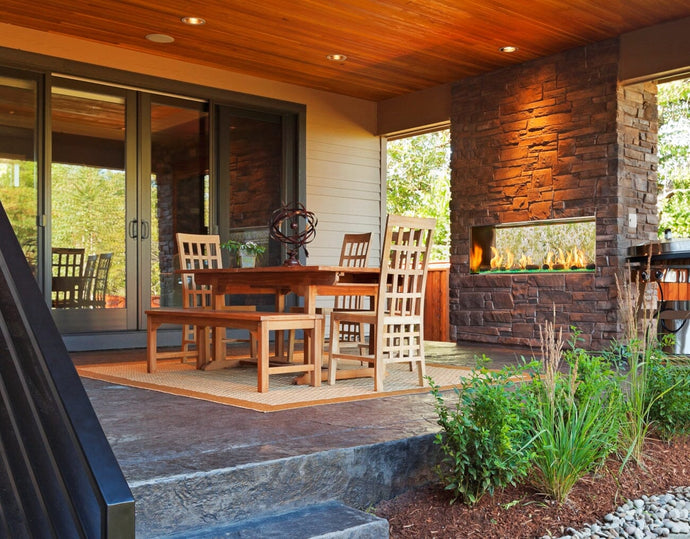 Majestic Lanai see through fireplace in a patio setting with brick surround