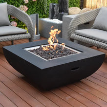 Load image into Gallery viewer, Modeno by Elementi Aurora fire pit table shown with a flame on a  patio deck