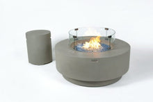 Load image into Gallery viewer, Elementi Plus Colosseo round fire pit with blue fire glass. With tank cover