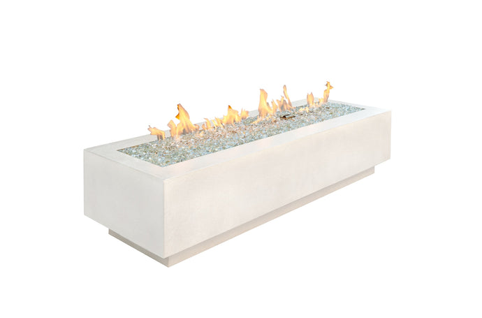 The Outdoor Greatroom Cove fire pit shown with flames on a white background