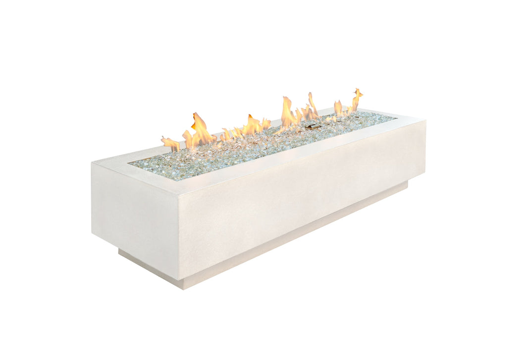 The Outdoor Greatroom Cove fire pit shown with flames on a white background